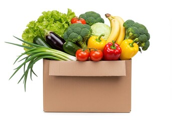 Assortment of fresh vegetables and fruits in a cardboard box isolated on white