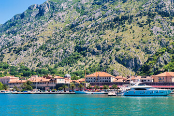 Kotor  Montenegro, May 11, 2024: The Bay of Kotor and boats and the mountainous background. The...