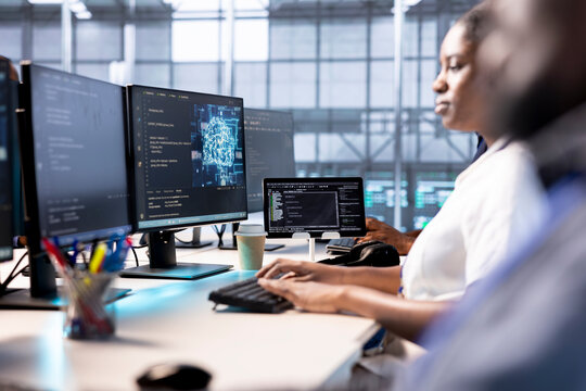 Server farm admin doing AI research, creating and implementing algorithms that aim to mimic human brain neural processes. Data center worker using artificial intelligence computational models