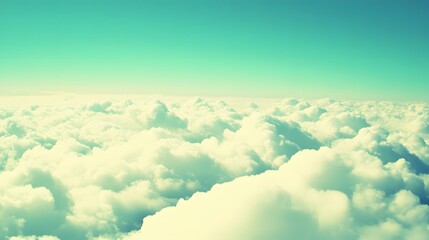 Fototapeta premium Stunning Aerial View of Fluffy White Clouds Above a Turquoise Sky