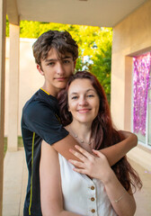 Naklejka premium A young man and woman are hugging each other.
