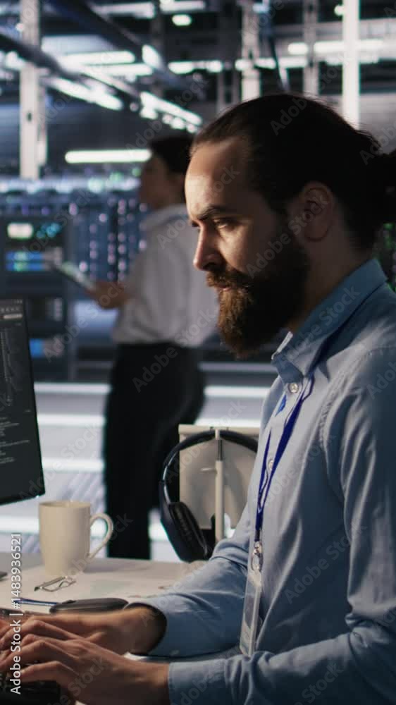 Poster vertical video overworked technician in data center managing server infrastructure for ai inference 