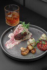 Meat Dish with Cream Sauce and Whiskey Glass