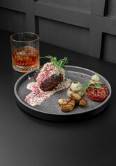 Top View of Plated Steak with Vegetables and Drink