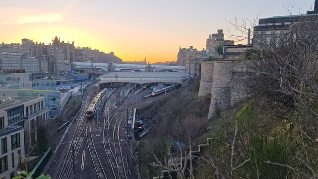 Modern main railway station in central Edinburgh, showing platforms, infrastructure, and integration with the surrounding city.