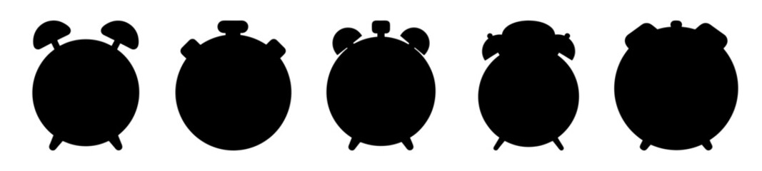 Collection of Five Silhouetted Classic Alarm Clocks Against a White Background