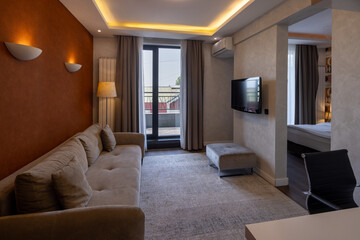 Modern hotel room interior with cozy sofa
