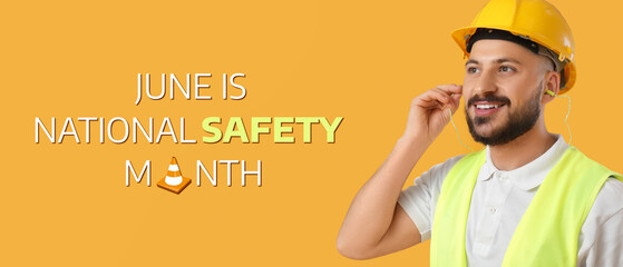 Male builder with earplugs on yellow background, closeup