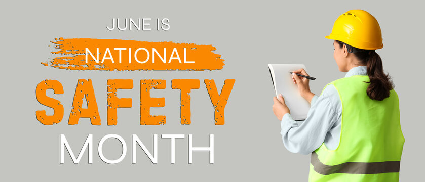 Young female construction worker with notebook and pen on grey background. Woman in male profession concept