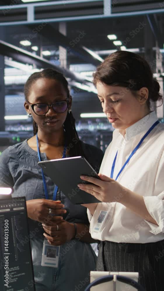 Poster vertical video teamworking engineers in data center integrate ai automation tools together during ma