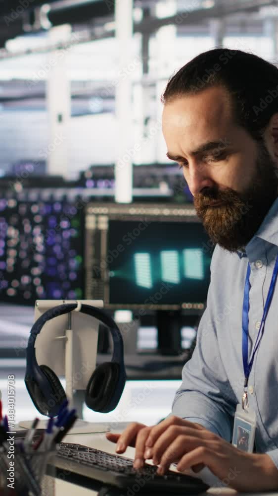 Poster vertical video panicked engineers in data center react to ransomware warning on pc display, scrambli