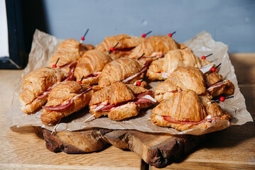 Mini Croissant Sandwiches with Ham and Cheese.