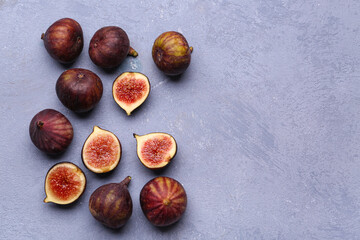 Fresh ripe figs on blue background