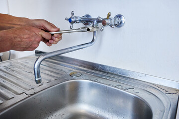 Mounting of faucet spout is performed by plumber using adjustable wrench designed for turning...