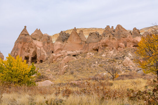 Cappadocia rock formation sites and chimneys. Kapadokya in Turkey, Love Valley. Tuff volcanic rock pillars and mushrooms in the museum under open sky in Cappadocia turkish famous tourist sight