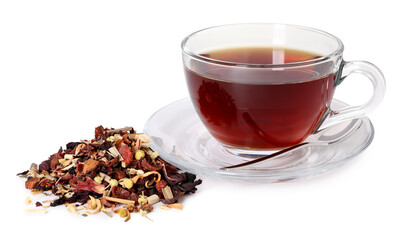 Delicious herbal tea in glass cup, spoon and dry leaves isolated on white