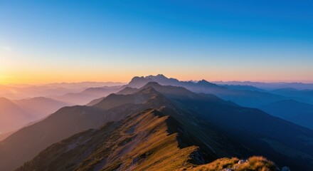 Mountain range at sunset representing natural beauty and serene landscape, with blue sky and golden light