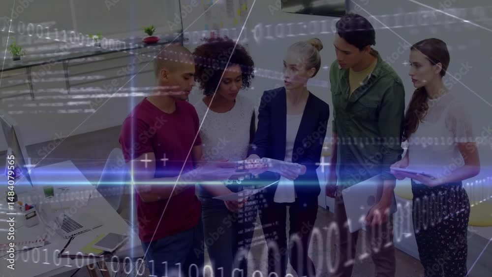 Poster coworkers clustering around tablet in open-plan office, displaying binary code and glowing lines