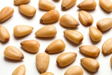 Obraz premium Raw pine nuts isolated on white background