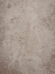 Detailed close-up of a textured ivory surface resembling aged plaster or stone with subtle variations and marks, perfect for backgrounds