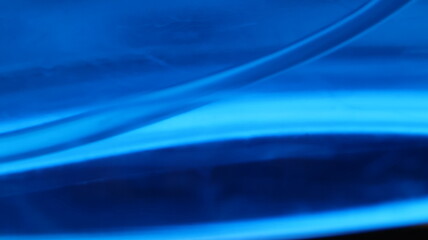 Dynamic blue wave texture with reflective highlights, ideal for water themes, innovation, or clean...