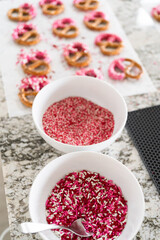 Homemade Gourmet: Delightful Pretzels Adorned with Pink Chocolate and Sprinkles