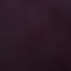 Dark blurred maroon surface, ideal for abstract design, emotional branding, or elegant backdrops.