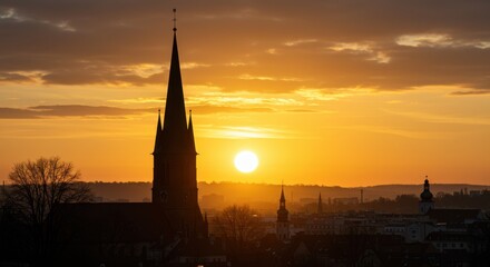 Obraz premium Church silhouette at sunset reflecting hope and faith, featuring golden sky and tower