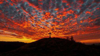 Silhouette of a cross on a hill at sunset, with vibrant clouds creating a dramatic sky, representing reflection and hope during the Good Friday celebration