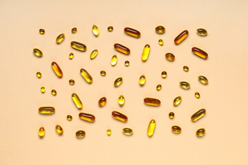 Composition with different fish oil capsules on color background