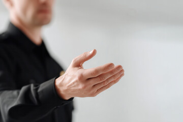 Obraz premium confident police officer portrait positioned on left side of frame hands out of view