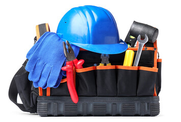 Bag with hardhat and construction tools on white background