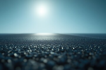 A sunlit, textured surface stretches to a bright horizon under a clear sky