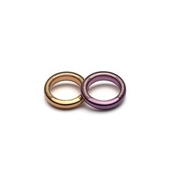 Two simple, minimalist rings, one gold, one purple, with a brushed finish