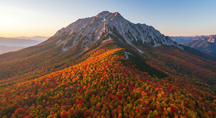 Fototapeta premium Autumnal Majesty of Mountain Slopes with Vibrant Foliage