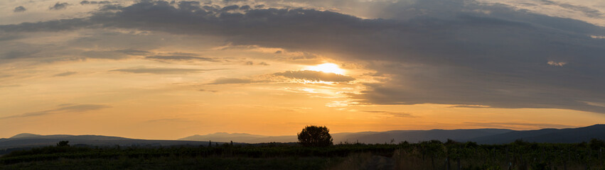 Sunset over the Balkans. The stillness and the dusk. Cirrus clouds in a crimson sky.