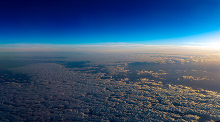 A sunset as seen from a plane flying high above the clouds in Australia