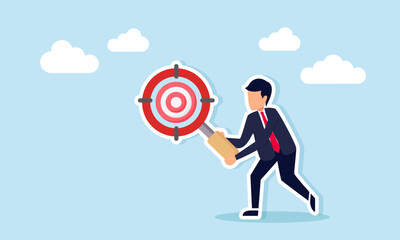 Businessman holding target-shaped magnifying glass examining target board illustration of comprehensive business target analysis