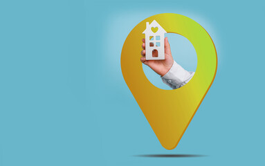 Hand holding a model house and location pin, real estate concept.
House for sale banner
