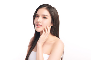 Fototapeta premium A beautiful young Asian woman with clean, fresh skin against a white background. Skincare, facial treatment, cosmetology, beauty, and spa. An elegant portrait of an Asian woman.