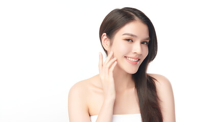 Naklejka premium A beautiful young Asian woman with clean, fresh skin against a white background. Skincare, facial treatment, cosmetology, beauty, and spa. An elegant portrait of an Asian woman.