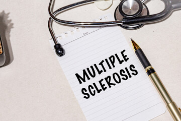 Multiple Sclerosis Written in Notebook, Set with Stethoscope on Doctor’s Desk – Medical Concept