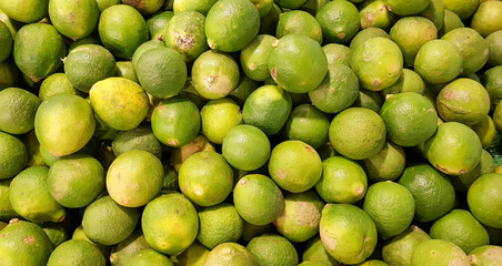 A pile of fresh green limes