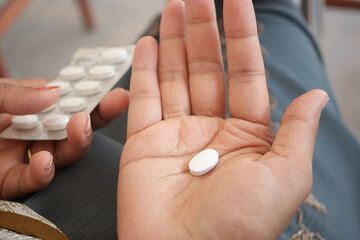 Person taking medication in a relaxed setting