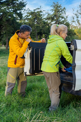 Adventurous couple setting up camp outdoors