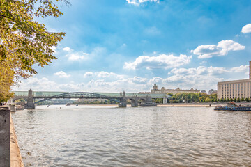 View of the Moscow river embankment, Pushkinsky bridge and cruise ships at sunset.