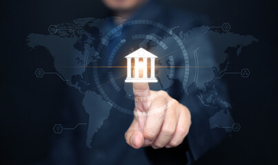 Online digital banking and financial technology concept: A man taps on bank icon to accesses mobile transactions worldwide