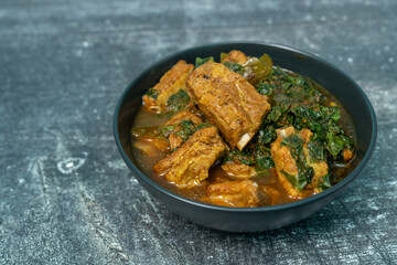 Spicy pork bone curry with betel leaves, a local dish from southern Thailand.