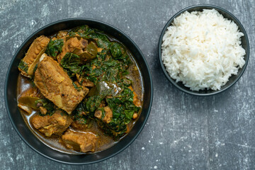 Spicy pork bone curry with betel leaves and rice, a local dish from southern Thailand.