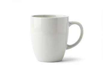 A simple white ceramic mug with a handle sits isolated on a white background